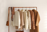 Rack with stylish women's clothes indoors. Modern interior design