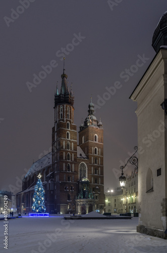 Winter night in Cracow marketplace, view to St. Mary's Church