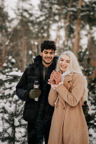 couple in winter forest