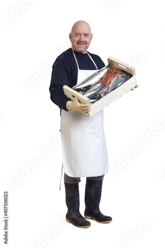 front view of a full portait of a fishmonger with a box of fish and seafood on white background, photo