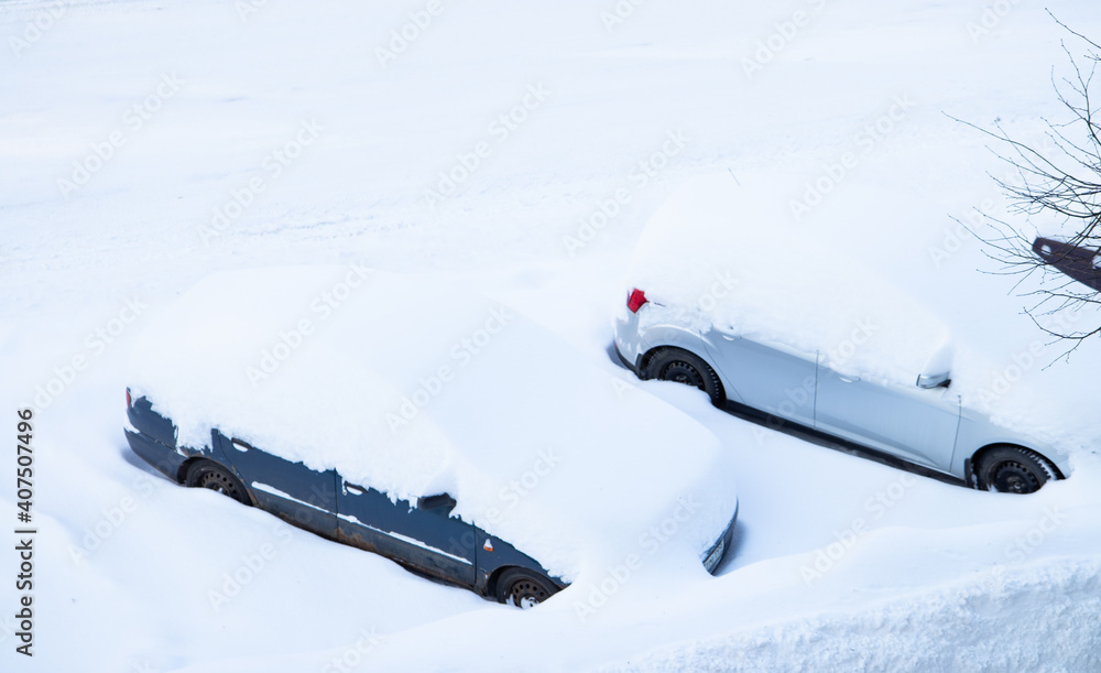 Snow Covered Cars parked outside in Russia wile it is Winter Time. Snow Covered Cars parked outside in Russia wile it is Winter Time.