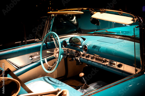 Driver's cockpit of a classic blue car
