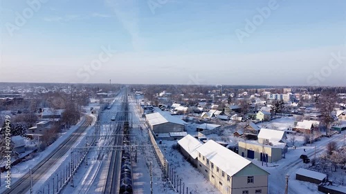 Flying over the city of Volosovo on a bright sunny frosty winter day. photo