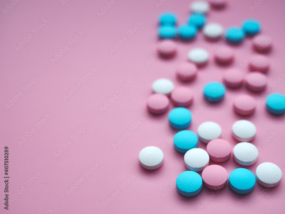 Vitamins, pills and tablets on pink background. Pharmaceutical products. Healthcare. Drug prescription for the treatment of a drug. Pharmacy theme. Copy space Vitamins, pills and tablets on pink background. Pharmaceutical products. Healthcare. Drug prescription for the treatment of a drug. Pharmacy theme. Copy space