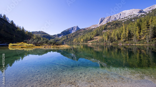 Idyllic mountain lake in the austrian alps with blue sky