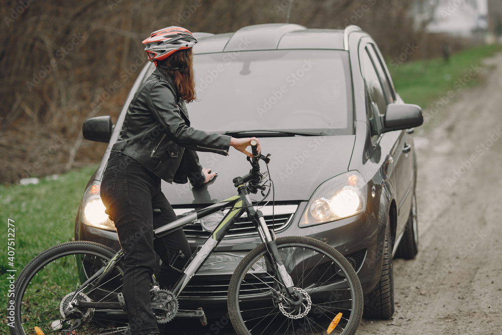 The woman crashed into the car. Girl in a helmet. The woman crashed into the car. Girl in a helmet.
