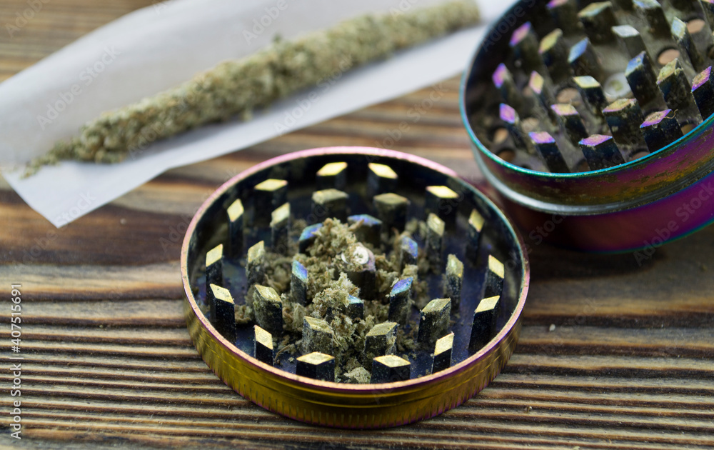 Grinder. A lot of marijuana, fresh buds of cannabis many weed. Copy-space Grinder. A lot of marijuana, fresh buds of cannabis many weed. Copy-space