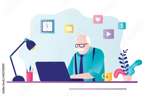 Elderly gray-haired businessman works on laptop. Male pensioner sits at desktop and works