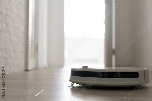 Robot Vacuum Cleaner In A Modern Living Room