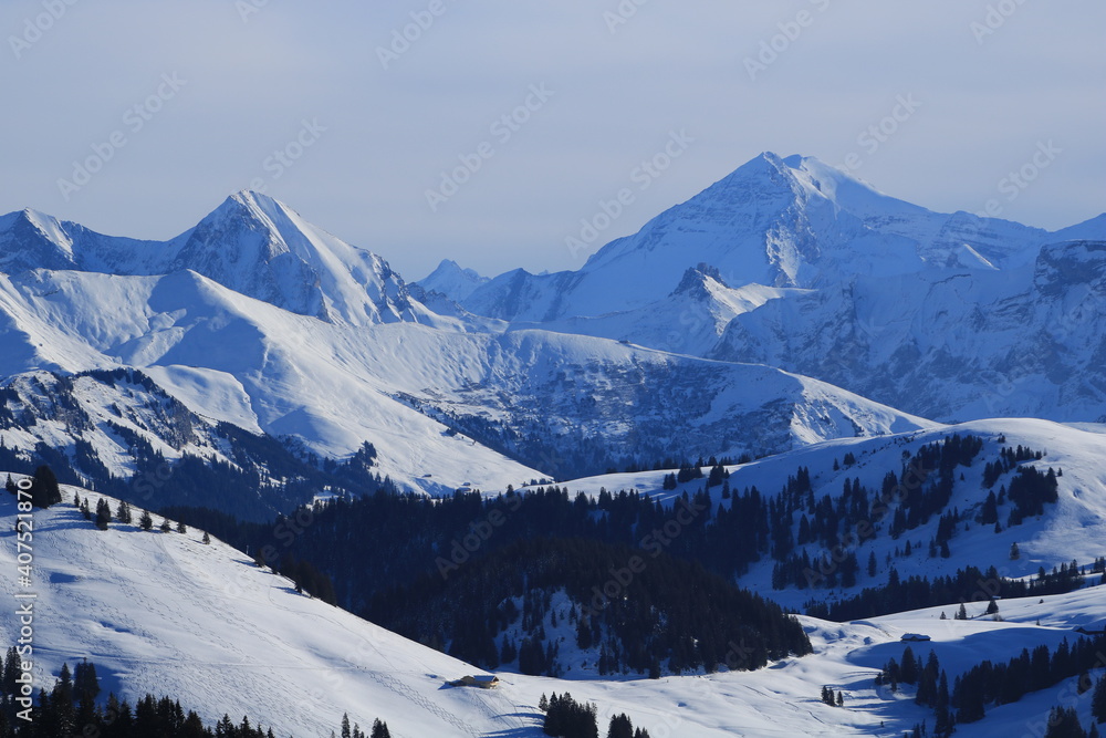 Fototapeta premium High mountains seen from the Horneggli ski area, Switzerland.
