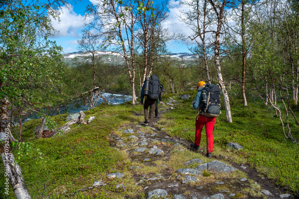 Hikers trekking and living the wanderlust dream. Hikers trekking and living the wanderlust dream.
