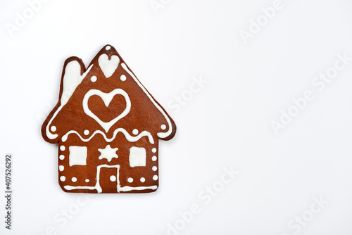 The hand-made eatable gingerbread house on white background