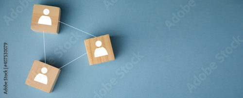 Wooden blocks connected on blue background photo