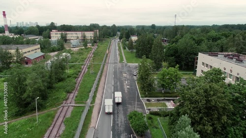 Two trucks are driving on the road. Overtaking. Aerial view.