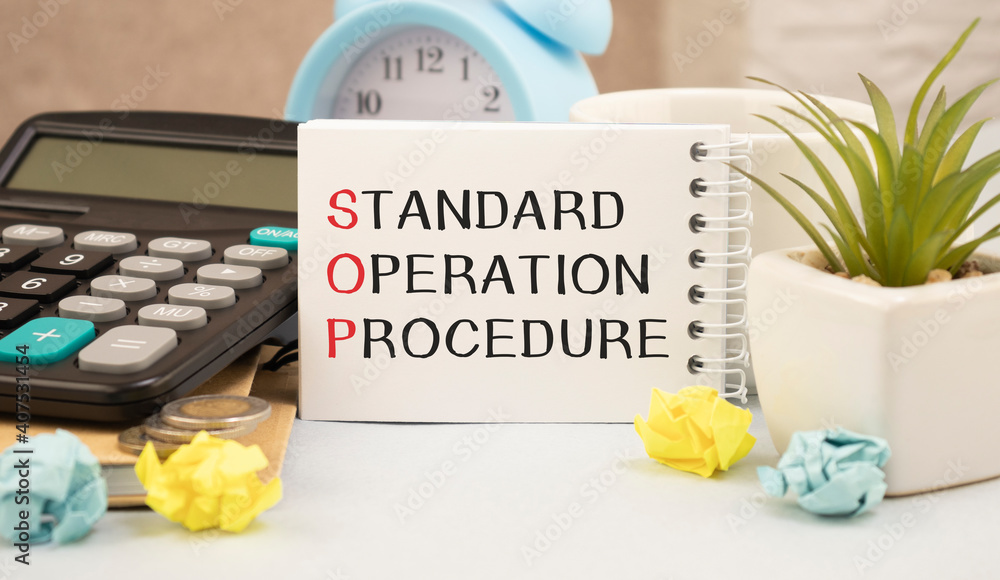 Standard Operating Procedure text on paper in open diary with
