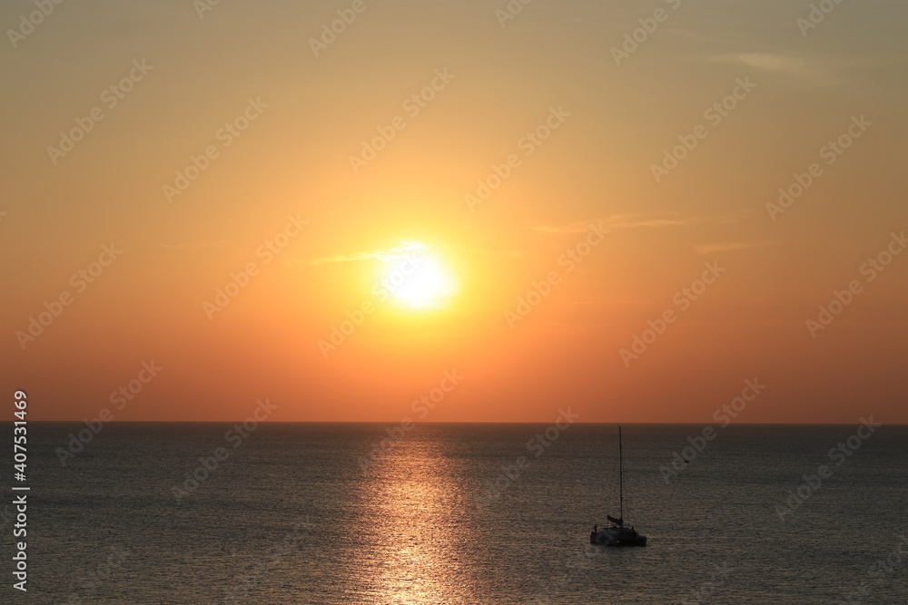 Sun set by the Beach the reflection of the sun beam on the ocean is very beautiful Sun set by the Beach the reflection of the sun beam on the ocean is very beautiful