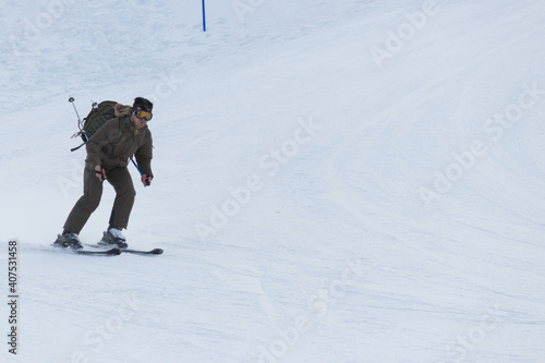 Winter sports and tourism center of Shahdagh. Skier skiing downhill in high mountain. Gusar - Azerbaijan photo