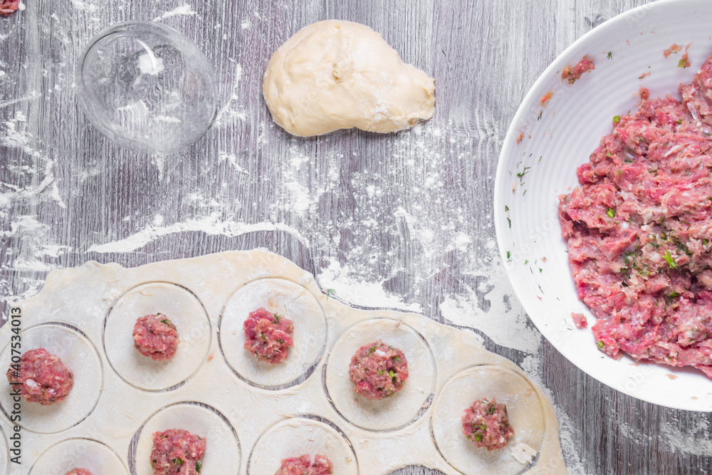 background of homemade meat dumplings or ravioli with meat