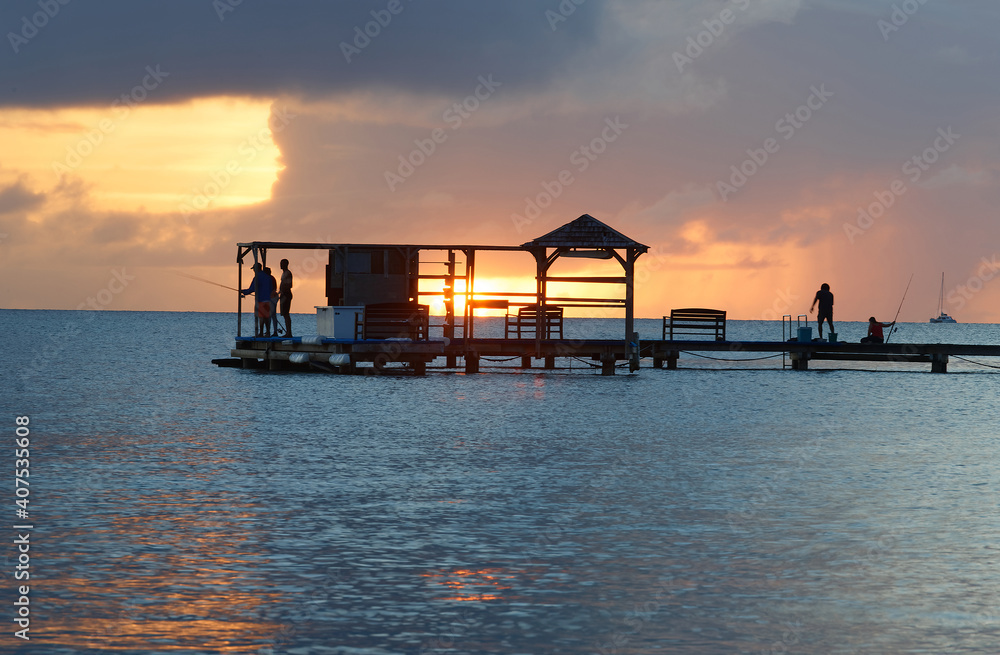 Silhouette fisherman wooden hut on seaview water over sunset sky background, Martinique island. Silhouette fisherman wooden hut on seaview water over sunset sky background, Martinique island.