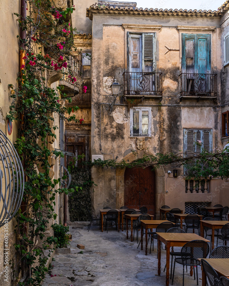 A small square among old buildings in Tropea historic centre, Calabria, Italy