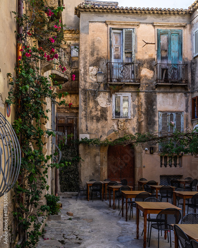 A small square among old buildings in Tropea historic centre, Calabria, Italy