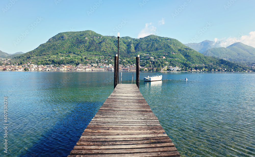 Old wooden dock on Lago di Garda Lake . Brescia Lombardy, Italy