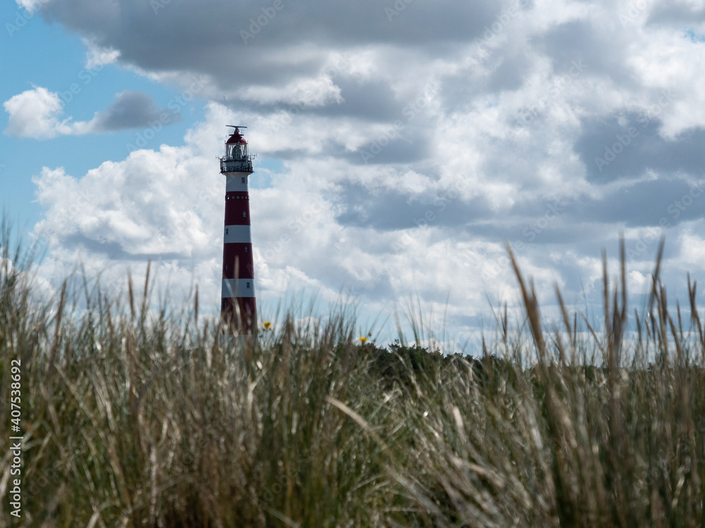 Lighthouse in the dunes of the island of Ameland, Hollum, Netherlands Lighthouse in the dunes of the island of Ameland, Hollum, Netherlands