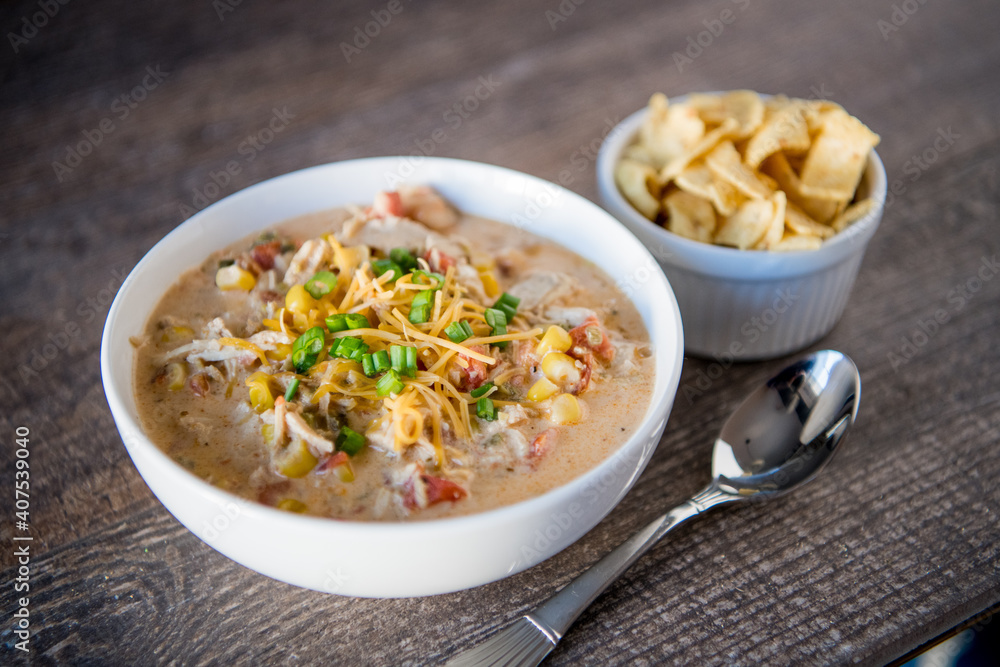 White chicken chili on wood table