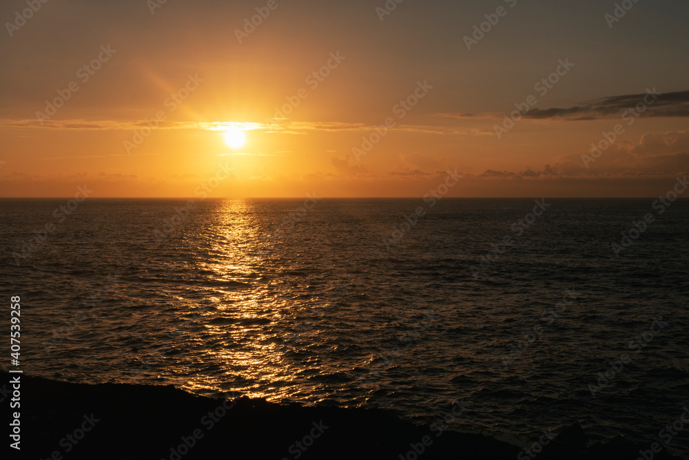 Naklejka premium sunset over the sea in asia