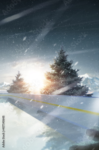 Rink. Vertical banner. Sunset in the mountains. Spruce trees around the rink