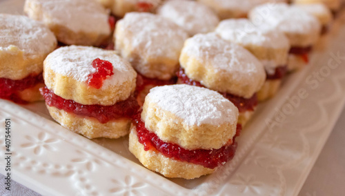  Close up of small vanilla cookies (vanilice), traditional Serbian jam sandwich cookies covered by powdered sugar