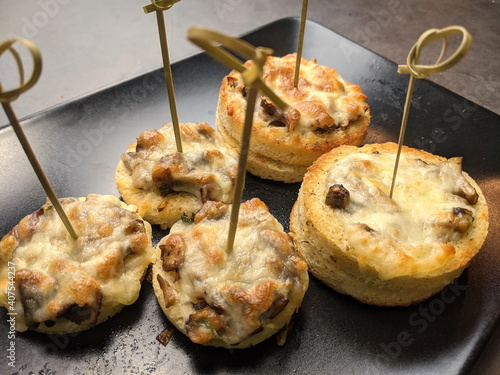 A platter of Cheesy Mushroom croustades or Cheesy Mushroom Discs photo