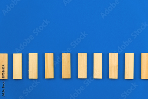 Template for business vision and development concept  blue background  copy space  vertical wooden blocks