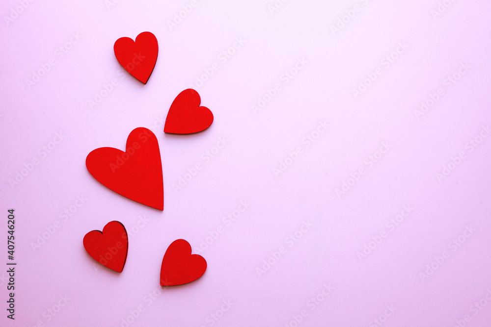 Red confetti over pink background with copy space for Valentine's Day