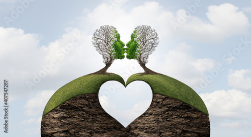 United love valentine concept with a heart shape and the power of romantic emotions or the power of lovers to move mountains as two trees shaped as a head giving a kiss photo