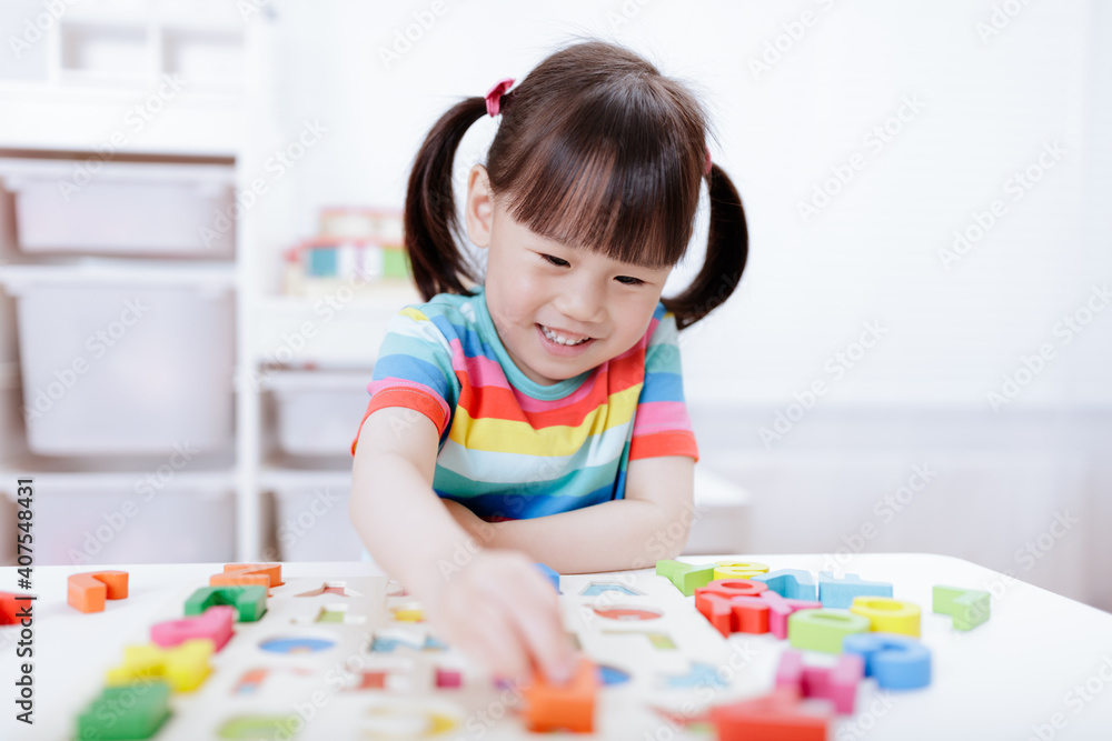 young girl learning letter blocks for homeschooling young girl learning letter blocks for homeschooling