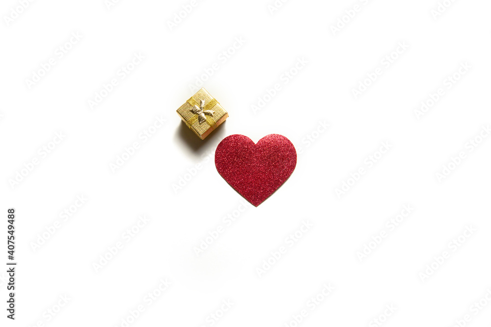 single red heart and small gift box on a white background. isolate. valentine's day