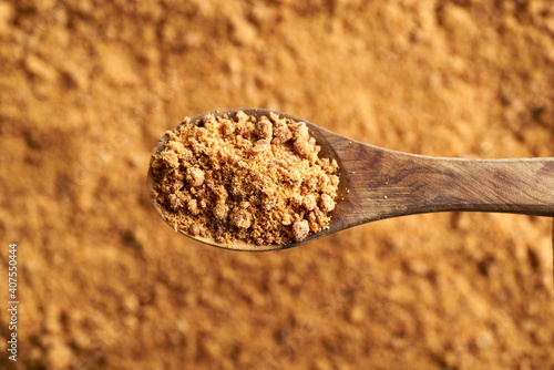 фотографія A spoonful of panela or rapadura - healthy sweetener made by evaporating sugerca
