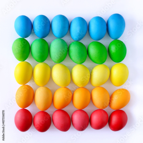 Easter eggs on white background, rainbow colors, top view