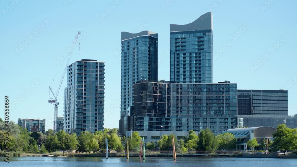 Modern cityscape, skyscrapers and office buildings overlooking a lake. Modern cityscape, skyscrapers and office buildings overlooking a lake.