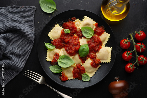Ravioli with tomato sauce on plate