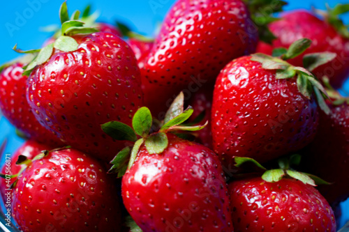  Fresh strawberries on light blue background