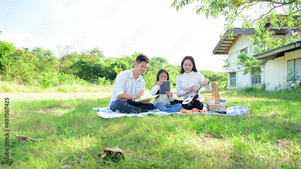 Asian Family trip father mother and daughter enjoy picnic freedom in garden to nature.lifestyle family vacation caucasian asian.one day trip new normol during Coronavirus covid-19. Asian Family trip father mother and daughter enjoy picnic freedom in garden to nature.lifestyle family vacation caucasian asian.one day trip new normol during Coronavirus covid-19.