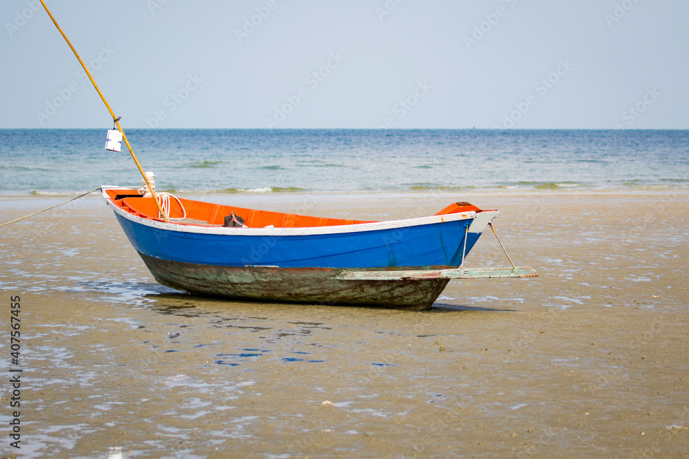 Fototapeta premium Image of small boat sitting on the beach.