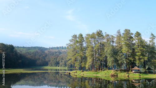 Scenic view of lake in forest against sky at Situ Patenggang, Bandung, Indonesia photo