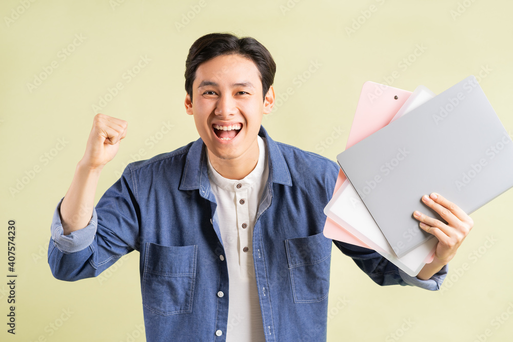 The photo of the handsome Asian businessman showing a successful expression The photo of the handsome Asian businessman showing a successful expression