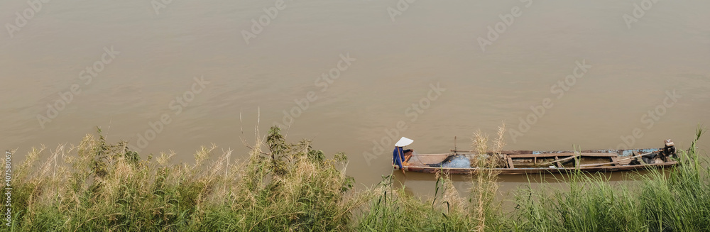 fishermen rowing boats to catch fish On the banks of the Mekong River in a panoramic view fishermen rowing boats to catch fish On the banks of the Mekong River in a panoramic view
