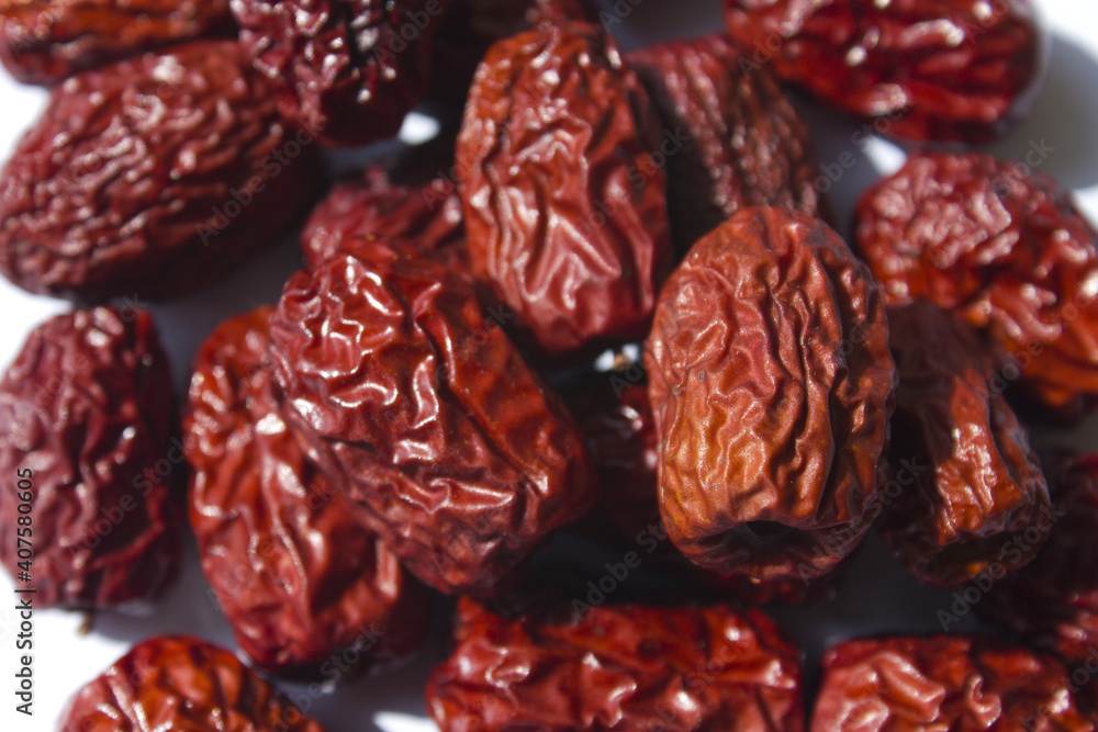 close up Red dates on white background. close up Red dates on white background.