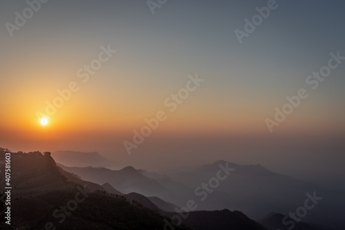mountain range sunrise at dawn with mist from flat angle