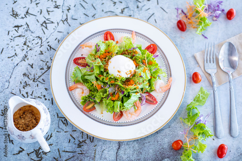 Salad with vegetables and poached eggs